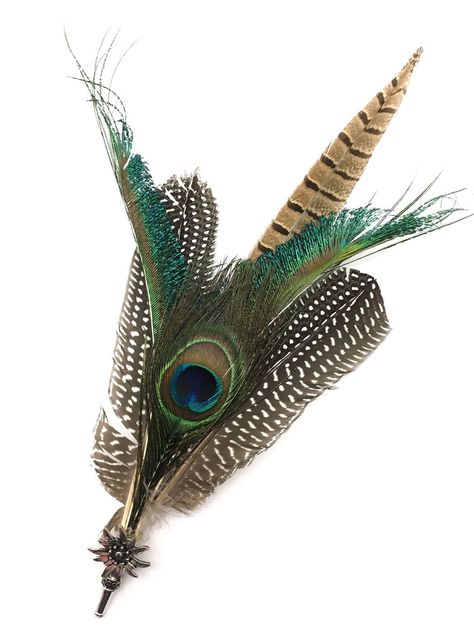 Unique and elegant metal hat pin with a silver plated edelweiss embellishment. Hat pin is accented with large deluxe peacock feathers with beautiful colors ranging from greens to whites making for a wonderful way to complement your German hat! Material: Metal Approximate Dimensions (Length x Width x Height): 0.5x4x13.5 Feather Ideas, Oktoberfest Hat, Lederhosen Costume, German Hats, Bavarian Costume, Oktoberfest Decorations, German Costume, German Oktoberfest, Oktoberfest Costume