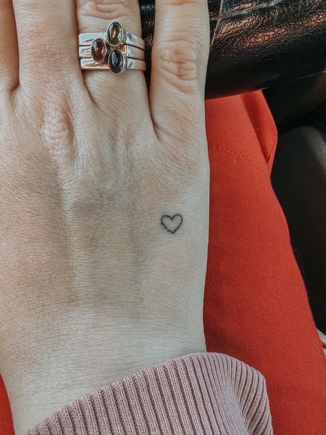 Tiny Heart Outline Tattoo, Small Heart Tattoo On Hand, Tiny Heart Tattoo, Hand Heart Tattoo, Heart Outline Tattoo, Love Heart Tattoo, Heart Tattoo Wrist, Tiny Tats, Tattoo Tiny