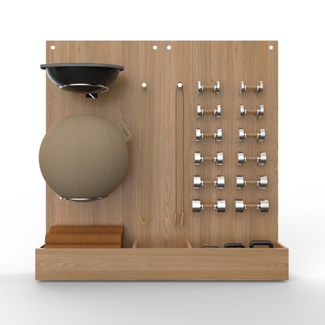 A completely bespoke design for a home gym or studio, made in Limed Oak & Stainless Steel. Originally designed for a specific project, the storage wall has been conceived to fit in an alcove in our client’s gym, and holds vertically a Technogym Balance DomeVluv Stov Ball, Skipping Rope, Power Bands and of course a bespoke set of our Paragon Studio Diabolo Dumbbells. At the base 3 cubbies store Airex Cork Yoga mats and Eleiko Kettlebells. Gym Furniture Design, Home Gym With Barre, Wall Gym Storage, Fitness Studio Storage, Minimal Home Gym Design, Classy Gym Interior, Corner Gym Ideas, Home Gym Storage Wall, Physio Gym Design