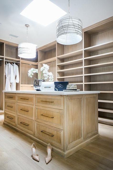 Custom walk-in closet boasts brushed oak built-in shoe shelves and clothing rails mounted beneath brushed oak shelves. Beach House Closet, Luxurious Beach House, House Closet, Beautiful Beach Houses, Closet Island, Walk In Closet Design, Pretty Kitchen, Oak Shelves, Custom Closet