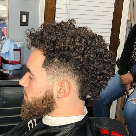 Top 20 Burst Fade Haircuts For Men To Try This Season Fohawk Haircut Fade Curly, Curly Fohawk Haircut, Boys Haircuts Curly Hair, Fohawk Haircut, Fade Haircut Curly Hair, Taper Fade Curly Hair, Curly Mohawk, Black Hair Cuts, Curly Hair Fade