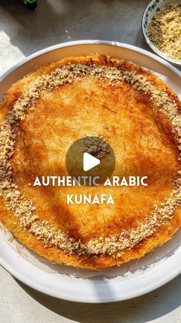 Rafia Mazhar on Instagram: "HERE'S HOW TO MAKE IT ⤵️ ⠀ COMMENT 'Kunafa' & I will DM you the details of purchasing authentic Kunafa Dough from anywhere in Pakistan 📩⠀ ⠀⠀⠀⠀⠀ Authentic Arabic Kunafa  Recipe Sugar Syrup ¾ cup water 1 cup sugar 1 tbsp rose water  • Prepare the sugar syrup by adding all the ingredients in a pan & cooking for 7 to 10 minutes till the sugar is dissolved and the syrup is slightly thickened. Not too thick. Set aside  Filling 1 cup milk 1½ tbsp cornflour  1 tsp vanilla 1½ tbsp sugar  • Prepare the filling by mixing all the ingredients in a pan and cooking till the mixture is thickened to a cream consistency. Set aside  Assembly  200 g mozzarella cheese grated 300 g kataifi pastry (kunafa dough) ⅓ cup ghee 1 pinch orange food colour  • Preheat the oven to 195°C • Tak Knafeh Recipe Video, Kunafa Recipe Video, Kunafa Dough Recipe, Easy Kunafa Recipe, Kataifi Recipe, Saudi Food, Kunafa Recipe, Kataifi Pastry, Buzzfeed Food Videos