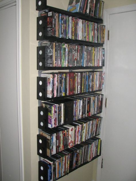 DVD shelves made from VHS tapes - LOL.  could make a good book shelf Movie Collection Shelf, Bluray Storage, Vhs Ideas, Vhs Crafts, Ikea Dvd Storage, Vhs Storage, Dvd Storage Tower, Dvd Storage Ideas, Dvd Storage Cabinet