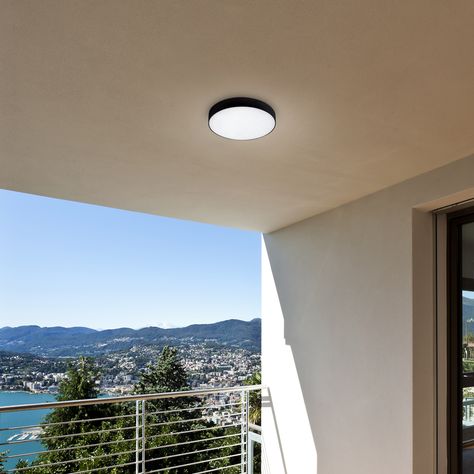 Tartu outdoor ceiling light representing the minimalist style will be a great choice for patio lighting. The round, matte black aluminum fixture is complemented by a white plastic lampshade and has a built-in LED lightsource. The A energy-class smart bulb has a power of 18W, a luminous flux of 1,800 lumens. Tartu can illuminate with cold, natural or warm white light. Exterior Ceiling Light, Balcony Lights, Balcony Lighting, Circle Light, Smart Bulb, Outdoor Balcony, Outdoor Ceiling, Led Stripes, Patio Lighting