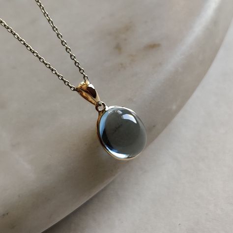 ITEM DESCRIPTION: >>The pendant is made from Solid 14K Yellow Gold. Gemstone used is absolutely natural and ethically sourced. >>Natural Sky Blue Topaz in cabachon and oval shape with bezel setting is studded on it with utmost precision. >>This is a minimalist design and is absolutely hassle-free and everyday jewelry. Gem: Sky Blue Toapz Gem size: 10x12 mm oval Gem weight: 7.68 carats Gold purity: 14K (58.33% approx.) Gold weight: 0.53 grams Gross weight: 2.07 grams The Gold purity is guaranteed Gold Skies, Handmade Jewelry Box, Blue Topaz Pendant, Topaz Pendant, Bezel Pendant, Sky Blue Topaz, Unique Gemstones, December Birthstone, Fantasy Jewelry