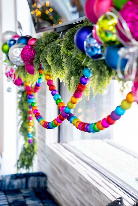 Add a festive pop of color with this playful holiday garland! 🌈 Strung with vibrant, multicolored ornaments and lush greenery, this garland brings joy and cheer to any holiday decor. Perfect for those who love bold and unique Christmas styling.  Colorful Holiday Garland, Festive Christmas Decor, Bold Holiday Styling, Multicolored Ornaments, Unique Christmas Garland, Playful Holiday Design, Christmas Decor Ideas, Vibrant Holiday Accents, Holiday Home Decor, Creative Christmas Styling Bright And Colorful Christmas Decor, Diy Tree Garland Christmas, Colorful Christmas Garland, Colourful Christmas Decorations, Maximalist Christmas, Bright Christmas Decorations, Christmas Styling, Colorful Christmas Decorations, Whimsical Christmas Decor