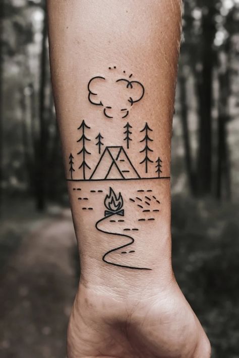 Tattoo of a camping scene with a tent, trees, fire, and clouds on an arm. Small Lake Tattoo Ideas, Camping Tattoo For Women, Camp Tattoo, Small Wrist Tattoo Ideas, Women Tattoo Inspiration, Wilderness Tattoo, Small Wrist Tattoo, Camping Tattoo, Lake Tattoo