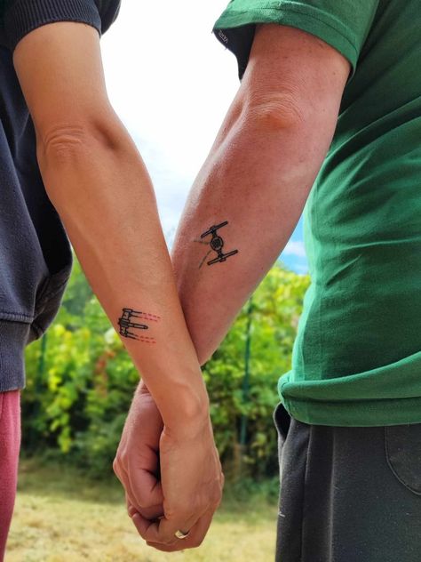 Star Wars tattoo 
Couple tattoo
X-wing, Tie Fighter tattoo
The Rebellion, The Empire
Light Side, Dark Side Marvel Couple Tattoos, Star Wars Couple Tattoo, Married Couple Tattoos, Pair Tattoos, Star Wars Couples, Metz France, Small Couple Tattoos, Marvel Couples, Couple Tattoo