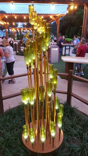 Wine bottle sculpture at epcot food and wine festival Glass Bottle Ideas, Bottle Sculpture, Epcot Food And Wine Festival, Wine Bottle Wall, Food And Wine Festival, Bottle Ideas, Glass Bottle Diy, Epcot Food, Wine Bottle Art