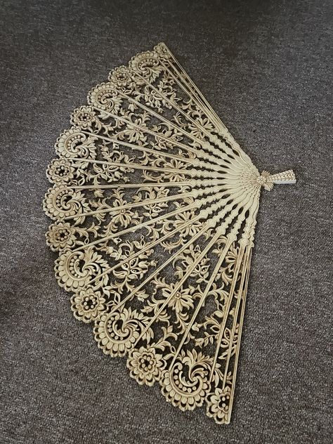 Looking for a large vintage statement piece to hang on your wall? This is it! So lovely! This ornate fan was made by Burwood Products Inc. #4402 out of the molded plastic resin they are famous for. It is large, measuring 27 inches tall, 43 inches wide, and approximately 1/4 inch thick. The detailed fan panels features flowers and leaves with a baroque, oriental feel. In excellent condition, no cracks. In a beautiful golden tan which would compliment most wall colors. This is certainly a dramatic piece of home decor! check out my online store fairhavenfinds.com Burlesque Fans, Regency Fan, Folding Fan Aesthetic, Fan Aesthetic, Rococo Fan, Feather Fan Burlesque, Vintage Hand Fan, Fair Haven, Hollywood Regency Decor