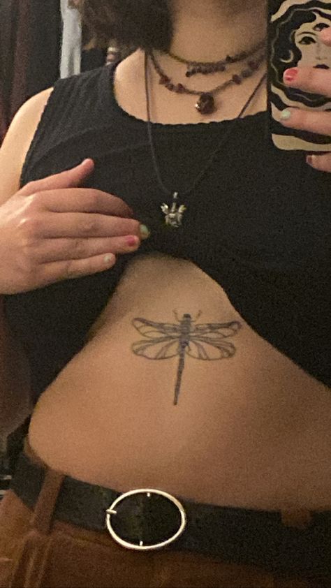 Dragonfly Tattoo Between Chest, Dragonfly Tattoo On Stomach, Rib Dragonfly Tattoo, Dragon Fly Stomach Tattoo, Dragonfly Tattoo Chest For Women, Dragonfly Tattoo On Chest, Back Tattoo Dragonfly, Dragonfly Sternum Tattoo Women, Dragonfly Stomach Tattoo