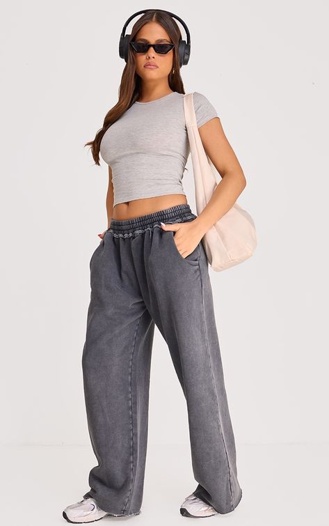 Hit refresh on your new season wardrobe with these washed charcoal extreme oversized slouchy wide leg joggers, they're a definite yes from us. Made using a washed charcoal material with an extreme oversized slouchy design and a wide leg style, these joggers just went straight to the top of your wish list. Pair with a basic top, a tote bag and your fave accessories for the perfect on the go look.   Length approx 78cm/30.5 (Based on a sample size S)   Model wears size S   Model Height - 5ft 8 Wide Leg Joggers Outfit, Wide Leg Track Pants, 2024 Wardrobe, Wide Leg Joggers, Animal Print Swimwear, Ny Outfits, Sportswear Outfits, Two Piece Set Pants, All Black Dresses