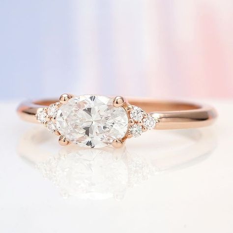 Meet the newest cluster-accented beauty to join our custom design gallery! 💍 It has an East-West set oval diamond with round diamond accents on either side, creating a low profile and dainty aesthetic. Designed and created by Joseph Jewelry | Seattle, WA | Bellevue, WA | Online | Design Your Own Engagement Ring | #engagementring Low Profile Engagement Rings, Custom Diamond Engagement Rings, Oval Halo Engagement Ring, Vintage Inspired Engagement Rings, Future Engagement Rings, Oval Diamond Ring, Diamond Cluster Engagement Ring, Oval Diamond Engagement, Moissanite Engagement Ring Solitaire