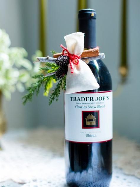 10 Creative Ways to Wrap a Wine Bottle Gift | Holiday Decorating and Entertaining Ideas & How-Tos | HGTV Wrap A Wine Bottle Gift, Wrap A Wine Bottle, Gift With Flowers, Wine Wrapping, Wine Bottles Gift Wrap, Wine Gift Wrapping, Pretty Presentation, Bottle Gift Wrapping, Wine Wrap