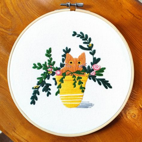 Hand-embroidered ginger cat in a yellow plant pot Ginger Cat Embroidery, Orange Cat Embroidery, Pansy Wreath, Yellow Plants, Cat Embroidery, Ginger Cat, Manchester England, Yellow Cat, Cute Embroidery