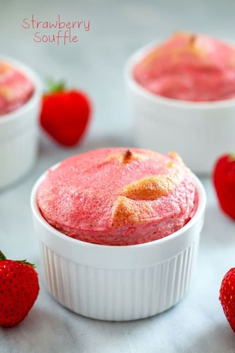 Head-on view of strawberry souffle in white ramekin with strawberries and additional souffles in background and "Strawberry Souffle" text at top Ramekin Desserts, Souffle Recipes Easy, Ramekin Dessert, Ramekin Recipes, Strawberry Souffle, Ramekin Recipe, Light Summer Desserts, Tiramisu Dessert, Souffle Recipes