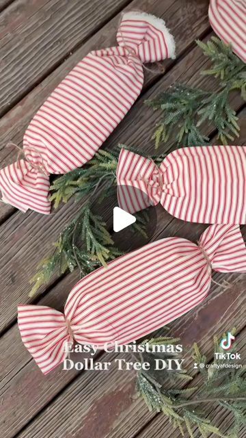 Alyssa Fossett on Instagram: "Easy oversized peppermint DIY using candy dishes from dollar tree and extra fabric! Added these to my front porch garland last year. ❤️🤍

#peppermint #gingerbread #diy #dollartree #budgethomedecor #crafts #easycrafts #christmas #christmasdecor #dollartreediy" Burlap Peppermint Sticks Diy, Peppermint Candy Tray, Front Porch Garland, Porch Garland, Gingerbread Diy, Peppermint Christmas, Peppermint Sticks, Candy Decorations, Holiday Craft