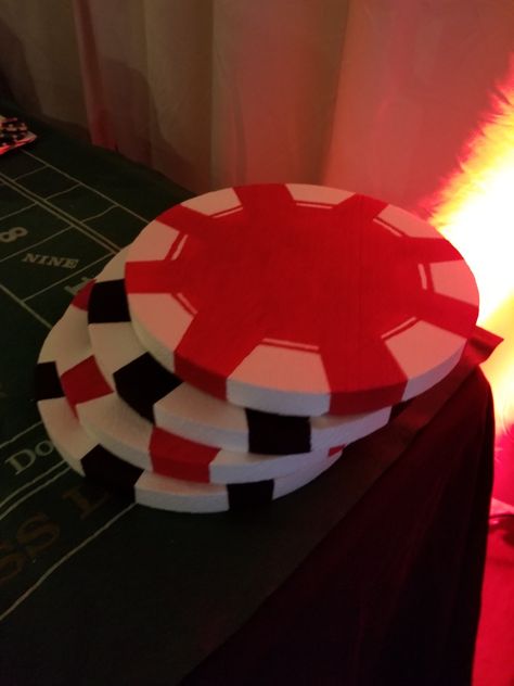 Found the idea to make giant poker chips and pressed our luck! Acrylic paint, painters tape and a paint brush is all you need! Super easy and looked great on the corner of our blackjack (cake and gift) table! Blackjack Party Decorations, How To Host A Poker Party, Vegas Diy Decorations, Poker Chip Decorations, Casino Sign Diy, Diy Casino Party Decorations, Poker Fundraiser Ideas, Dollar Tree Casino Decorations, Diy Las Vegas Sign