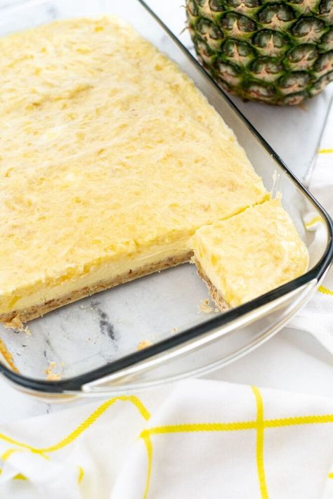 This delicious pineapple cheesecake has a creamy and rich topping that will make you feel like you’re eating a slice of your grandma’s delicious homemade pie! This easy pineapple cheesecake screams sunshine and warmer weather. This beloved cheesecake recipe is an easy dessert to bring to your next backyard BBQ, a church potluck, or really just because you have a sweet tooth any night of the week. It’s a delicious dessert that is light and creamy with each and every… Pineapple Cheesecake Tart 12 Tomatoes, Pineapple Cheesecake Bars, Woolworth Cheesecake Recipe, Pineapple Topping, Pineapple Cheesecake, Almond Crust, Favorite Pie Recipes, Cream Cheese Bars, Cheesecake Tarts