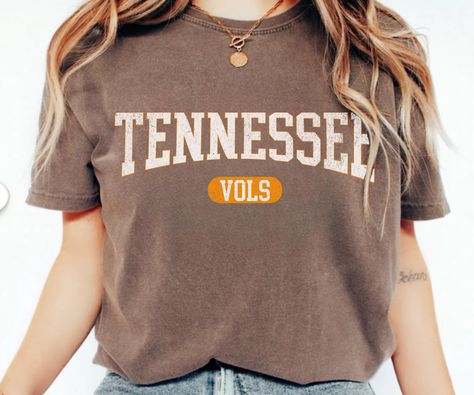 Are you looking for Vintage Tennessee Vols Football T-shirt? We got you!❤️ Celebrate game day in style with this Vintage Tennessee Football T-shirt! Perfect for any fan, this Tennessee Game Day graphic tee makes a great Tennessee Travel Gift or Gift For Football Lover Mom Shirt. Show your team pride wherever you go! 👉ABOUT OUR  Tennessee Game Day Comfort Color T-shirt  ▸ 100% ring-spun US cotton for long-lasting comfort.  ▸  The garment is sewn around the finished edges with double stitching, m Tennessee Football Shirts, Nashville Essentials, Tennessee Game Day, Vintage Tennessee Vols, Tennessee Graphic, Tennessee Vols Football, Vols Football, Vintage Tennessee, Tennessee Shirt