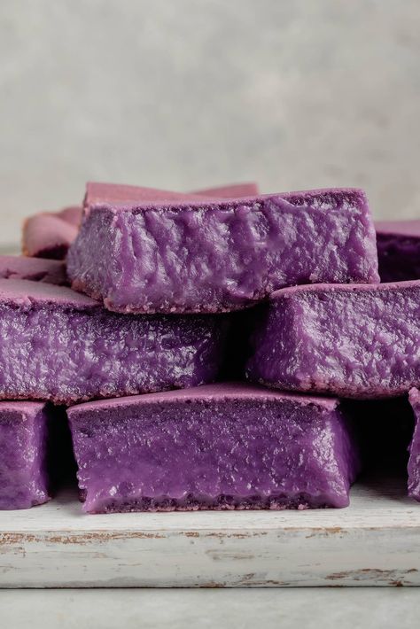 This Ube Butter Mochi is a fun, Filipino twist on the popular Hawaiian Butter Mochi. It's deliciously chewy, slightly crisp around the edges, and infused with the sweet, nutty flavor of ube. All you need is a few simple ingredients!  #ubehalaya #buttermochi #ubemochi #filipinofusion #vegan #sweetsimplevegan #ube Ube Mochi Recipe, Ube Butter Mochi, Ube Butter, Palitaw Recipe, Hawaiian Butter Mochi, Ube Mochi, Ube Ice Cream, Ube Recipes, Butter Mochi