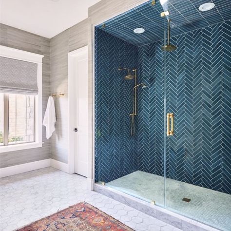 Bathrooms of Instagram on Instagram: “Deep blue tile laid in a herringbone pattern, marble trimmed wall niches, and anti-slip marble penny tile on the floor makes this shower a…” Master Bath Blue Tile Shower Ideas, Small Bathroom Tile Ideas Wall, Blue Herringbone Tile, Blue Shower Tile, Dark Blue Tile, Blue Bathroom Tile, Teal Bathroom, Shower Wall Tile, Bathroom Remodels