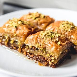 Turkish Baklava, also known as Fistikli Baklava or Pistachio Baklava is a deliciously rich, buttery, sweet dessert made from phyllo dough, finely ground pistachios, butter, and a syrup made from sugar, water and lemon juice.  That's it! Walnut Baklava, Turkish Baklava, Turkish Sweets, Baklava Recipe, Turkish Desserts, Blueberry Coffee, Chocolate Bundt, Blueberry Coffee Cake, Sweet Bakes