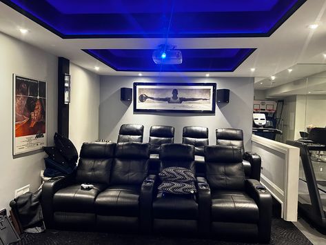 Custom home theatre installation in dedicated theater room in the basement of a house. 110” acoustically transparent projector screen was installed for center channel in-wall speaker sound to pass through the screen. 2 rows of Home theater seating placed in the room for true cinematic experience right at home! Starlight ceiling and cove lighting installed for accent lighting that adds extra coziness and stunning visual. #hometheater #homecinema #customhometheater #customhomecinema #homethe... Starlight Ceiling, Home Theater Installation, Star Lights On Ceiling, Cove Lighting, In Wall Speakers, Home Theatre, Theatre Room, Theater Room, Projector Screen