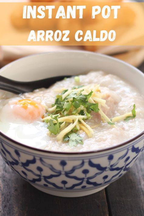 Instant Pot Arroz Caldo, aka Lugaw or Filipino rice porridge, in a bowl and garnished with egg. Rice Porridge Instant Pot, Instant Pot Arroz Caldo, Filipino Rice Porridge, Instapot Filipino Recipes, Arroz Caldo Instant Pot, Caldo Instant Pot, Arroz Caldo Filipino Recipe, Arroz Caldo Recipe, Chicken Rice Porridge