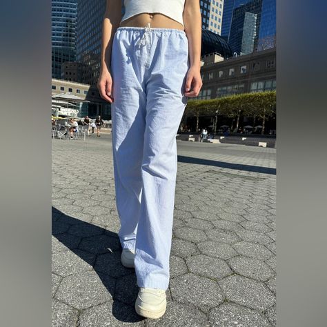 Wide Leg White And Blue Striped Linen Pants With A Drawstring Waist, And Side Pockets. Fabrics: 100% Cotton Measurement: 11" (28 Cm) Rise, 28" (71 Cm) Inseam, 26" (66 Cm) Waist (Stretches) Made In: China Brandy Linen Pants, Brandy Blue Sweatpants, Pin Stripe Pants Outfit, Brandy Melville Blue And White Sweater, Brandy Melville Linen Pants, Brandy Striped Pants, Priscilla Pants Brandy Melville, Brandy Melville Cargo Pants, Brandy Melville Striped Pants