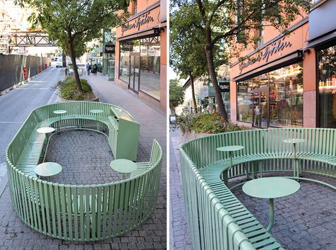 Created from green painted steel, this sculptural outdoor dining area, integrates seating, tables and recycling. #OutdoorSeating #StreetFurniture Innovative Outdoor Seating, Modern Public Seating, Utopia Ideas, Communal Seating, Outdoor Seating Ideas, Landscape Furniture, Urban Furniture Design, Cafe Seating, Public Space Design