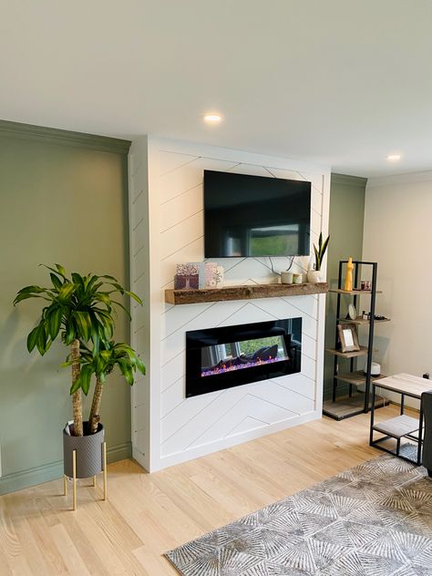 Our Shiplap fireplace with evergreen fog walls Shiplap Herringbone Fireplace, White Fireplace Green Wall, Green Wall White Fireplace, Evergreen Fog Fireplace, Herringbone Shiplap Fireplace, Evergreen Fog Walls, Green Shiplap Fireplace, Green Fireplace Wall, Vertical Shiplap Fireplace