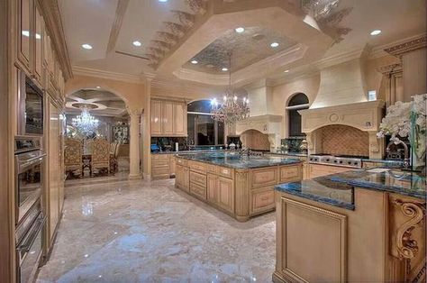 This giant kitchen has plenty of cupboard space, a large chandelier, elegant styling and a whole lot more. With the marble floors and giant stove you've got something super high end here. Luxury Kitchen Design, Luxury Homes Dream Houses, Luxury Kitchens, Large Kitchen, Counter Tops, Decor Minimalist, House Goals, Style At Home, Dream Rooms