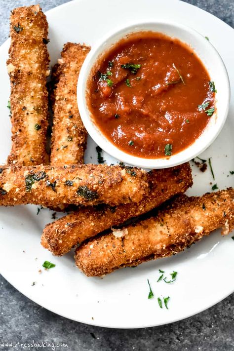 Homemade mozzarella sticks are easy to make in less than 30 minutes! String cheese sticks are coated in batter and deep fried to golden, melted cheesy perfection. I've also included my favorite marinara sauce recipe for dipping. | easy mozzarella sticks | easy fried mozzarella | fried cheese sticks | super bowl appetizer | stress baking recipes | stressbaking.com @stressbaking.com #stressbaking Easy Homemade Mozzarella Sticks, Easy Homemade Mozzarella, Easy Mozzarella Sticks, Fried Cheese Sticks, Homemade Mozzarella Sticks, Mozzarella Sticks Recipe, Fried Mozzarella, Homemade Mozzarella, Oaxaca Cheese