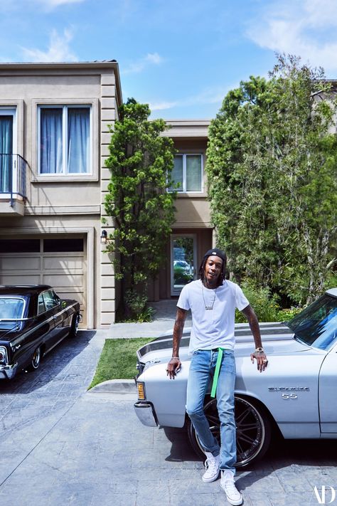 Wiz Khalifa perched on top of one of his cars outside his house. Whiz Khalifa, Shoot Concept, Celebrity Home, Maroon 5 Lyrics, Taylors Gang, Evan Ross, Ashlee Simpson, Famous Movie Quotes, Rap Wallpaper