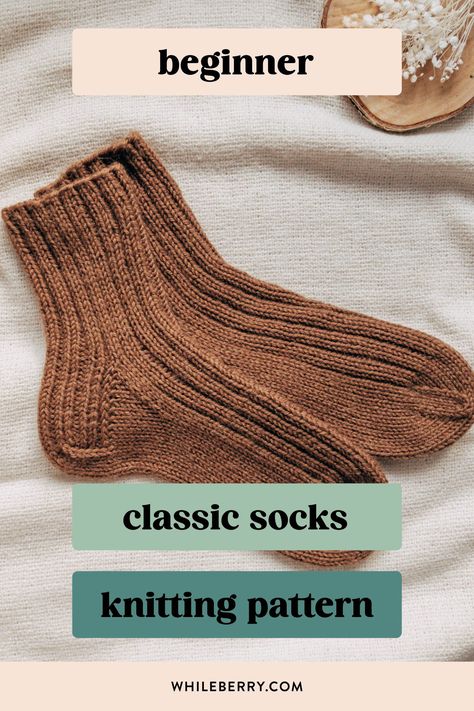 If you've always wanted to knit basic cozy socks, use this minimalist knitting pattern to knit your first simple sock pair! Using worsted weight yarn, they are super quick to knit and will be a great choice for gift knitting too. Find this beginner sock knitting pattern at whileberry.com Handknit Socks Free Pattern, Ribbed Socks Knitting Pattern, Easy Knitting Gifts, Beginner Knit Socks Free Pattern, What To Knit For Beginners, Quick Knitted Gifts, Small Knitting Projects For Beginners, Free Sock Pattern, How To Knit Socks For Beginners