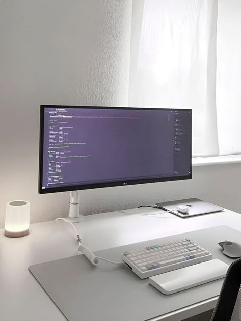 A clean and efficient desk setup featuring a computer monitor and keyboard in a distraction-free white workspace. Productive Desk Setup, White Desk Setup, Minimal Workspace, Team Office, Desk Setup Ideas, Bedroom Plan, Clean Workspace, Positive Environment, Gaming Ideas