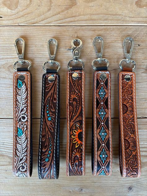 Gorgeous handmade genuine hand tooled keychain wristlets! Perfect accessory for your keys... Measures approx. 1" wide x 7.5" long Country Christmas Gift Ideas, Christmas List Western, Country Wishlist Ideas, Car Accessories Western, Western Keychain Ideas, Western Christmas Gifts, Tooled Keychain, Leather Tooling Keychain, Tooled Leather Wristlet Keychain