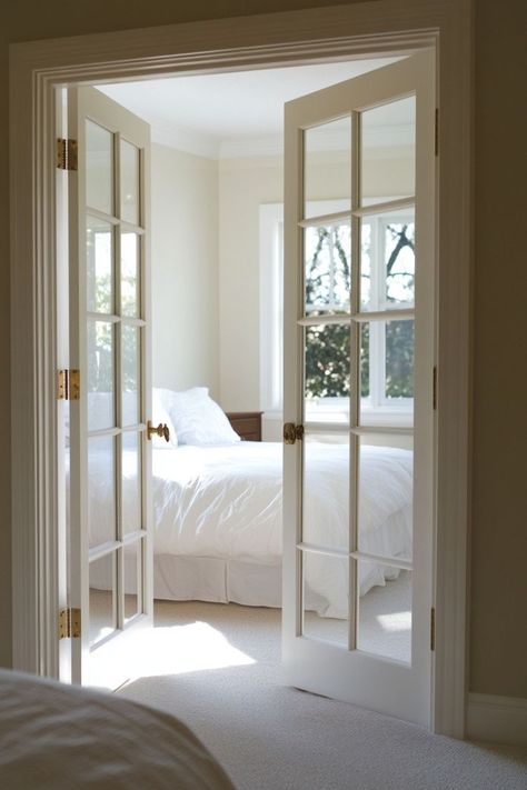 Add a touch of elegance to your bedroom with classic French doors for your closet. These beautiful doors enhance the room’s sophistication while providing easy access. 🚪🌿✨ #FrenchDoors #ElegantLiving #BedroomDesign #ElevatedCloset Small Bedroom With French Doors, Types Of French Doors, French Doors For Bedroom, Walk In Closet French Doors, French Sliding Door Interior, French Doors In Bedroom To Outside, Double Doors To Bedroom, Bathroom With French Doors, Inside French Doors