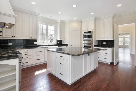 Attractive kitchen with white cabinetry and Dakota mahogany granite counter tops. Resurfacing Kitchen Cabinets, White Cabinets With Granite, Cost Of Kitchen Cabinets, Kitchen Refacing, White Kitchen Traditional, Kitchen Layouts With Island, Refacing Kitchen Cabinets, Refinish Kitchen Cabinets, Refinishing Cabinets