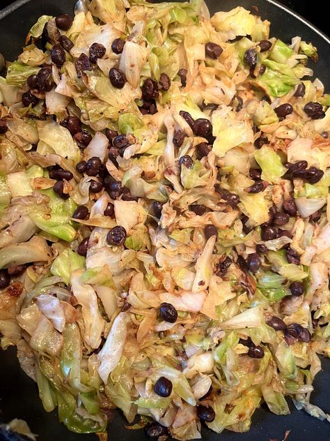 This Cabbage and Beans recipe is a delicious, budget-friendly vegetarian main dish that is perfect for a quick and healthy dinner. With fresh cabbage and hearty black beans, seasoned simply with salt, pepper, and garlic powder, this dish is full of flavor and nutrients. Enjoy a wholesome meal that's ready in just 20 minutes! Black Beans And Cabbage, Cabbage And Beans, Sauteed Red Cabbage, Healthy Cabbage, Vegetarian Main Dish, Blanching Green Beans, Cabbage Rice, Black Bean Recipes, Flavorful Vegetables