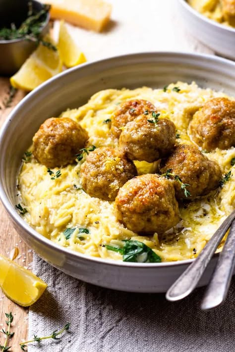 Easy to make, bursting with fresh lemon flavor and so delicious! Tender chicken meatballs are baked in lemon and garlic infused butter and served over creamy parmesan spinach orzo that's all made in just one pot! Serve the meatballs over the creamy orzo and drizzle with extra lemon butter. Creamy Spinach Orzo, Butter Chicken Meatballs, Chicken Meatball Recipe, Spinach Orzo, Chicken Meatball, Cheesy Spinach, Lemon Butter Chicken, Chicken Meatball Recipes, Meatball Recipe