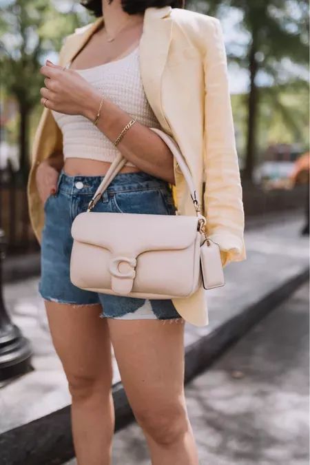 The perfect cream bag for spring and summer to complete all your outfits for 2023. The Coach Pillow Tabby is the perfect addition to any wardrobe. Pair with so many things, but I love it with denim cut offs a crochet knit crop top and linen blazer. Shop this entire look on my LTK. Coach Tabby Bag, Coach Pillow Tabby, Outfits For 2023, Tabby Shoulder Bag 26, Coach Pillows, Tabby Shoulder Bag, Cream Bag, Coach Tabby, Cream Bags