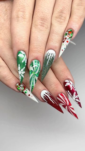 The Grinch Acrylic Nails, One Red Hand One Green Hand Nails, Extreme Christmas Nails, Green Red And White Nails, Christmas Nails Maximalist, Red And Green Xmas Nails, Red Green And White Christmas Nails, Christmas Green Nails Acrylic, Clear Christmas Nails