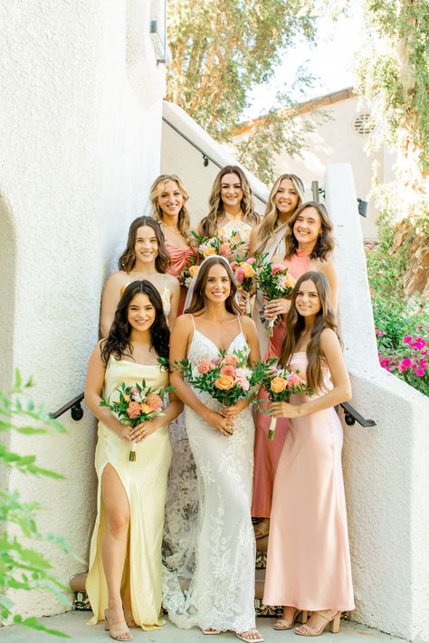 Desert wedding with colorful bridesmaids. Wedding Dress: Betty by Flora Bridesmaids Dresses: Revolve, Beginning Boutique, Asos, Mumu, princess polly (search slip/silk dresses & pick color palette) Cohesive Bridesmaid Dresses, Pink Yellow Orange Bridesmaid Dresses, Desert Bridesmaid Dresses, Warm Tone Bridesmaid Dresses, Spring Mismatched Bridesmaid Dresses, Sunset Color Bridesmaid Dresses, Pink And Yellow Bridesmaid Dresses, Pastel Color Palette Wedding, Sunset Bridesmaid Dresses