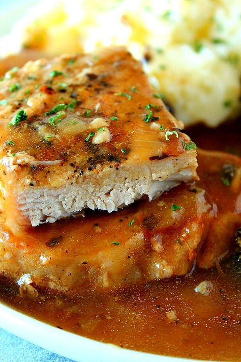 Instant Pot Smothered Pork Chops Recipe - saucy pork chops cooked in the Instant Pot with onion mushrooms gravy. Perfect easy recipe with boneless chops, served with mashed potatoes and roasted veggies. Instant Pot Smothered Pork Chops, Instapot Pork Chops With Gravy, Instapot Pork Chops Cream Of Mushroom, Mushroom Pork Chops Instant Pot, Instant Pot Smothered Pork Chops With Cream Of Mushroom Soup, Smothered Pork Chops Recipe, Instant Pot Pork Chops, Boneless Pork Chop Recipes, Smothered Pork Chops