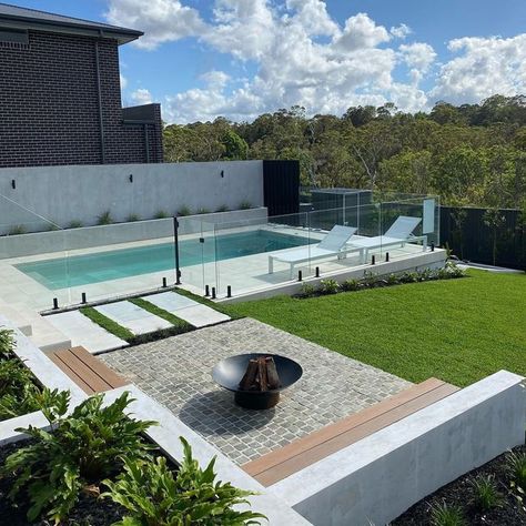 Outdoor Designer Store on Instagram: "Weekend Reset ✨...​​​​​​​​ ​​​​​​​​ Lazing by the pool in this backyard retreat is set to balance and nourish your mind, body & soul.​​​​​​​​ ​​​​​​​​ Designated fire pit area is fantastic feature in creating a focal point and a place for people to gather around and connect. ​​​​​​​​ .​​​​​​​​ Landscaping by @fcglandscaping" Backyard Pool Fire Pit, Plunge Pool And Fire Pit, Fire Pit Pool Area, Fire Pit Near Pool Area, Backyard Pool And Fire Pit Ideas, Pool Outdoor Area, Small Pool Landscaping Ideas, Pool And Fire Pit Ideas Backyards, Pool With Fire Pit Area