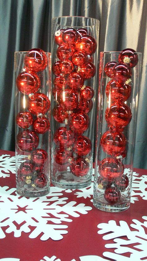 I love plain Christmas Balls in clear vases....we played with all red, in a trio of vases, with different sizes of red. Lovely! Vase With Christmas Ornaments, Corporate Christmas Party Decorations Centerpiece Ideas, Red Christmas Party Theme, Formal Christmas Party Decorations, Company Christmas Party Decorations, Red And White Christmas Party, Red Party Ideas, Volunteer Christmas, Red Christmas Party