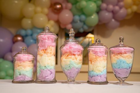 Pastel rainbow cotton candy layered in apothecary candy jars Pastel Gift Table, Cotton Candy Table Decor, Sweets Themed Birthday Party Centerpieces, Pastel Rainbow Birthday Centerpieces, Two Sweet Birthday Party Centerpiece, Apothecary Candy Jars, Cotton Candy Birthday Party Theme, Candy Buffet Tables Birthday, Pastel Party Centerpieces