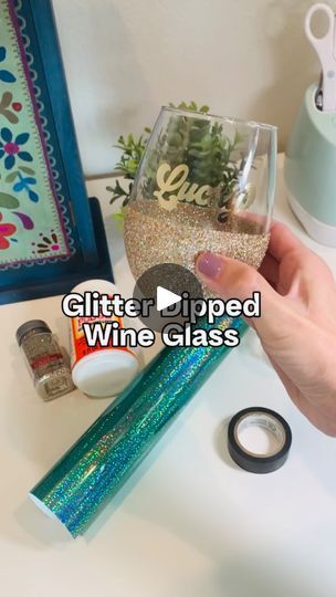 17K views · 4.1K reactions | How to make a glitter dipped wine glass with peekaboo shamrocks ☘️

These glasses are so fun and festive! For the peekaboo shamrocks, be sure to choose a vinyl that has color on both sides. I used @cricut holographic vinyl. 

You’ll also need extra fine glitter, mod podge, and electric tape. I like electric tape because it has a little stretch, but you can also use painter’s tape! 

#glitteredwineglass #stpatricksdaycrafts #cricutcrafts #modpodge #glitterdipped #cricutideas #crafttutorials | Lisa I Cricut Tutorials & Crafts | Babe Rainbow · Peace Blossom Boogy Mod Podge Wine Glasses, Wine Cups Vinyl Ideas, Glitter Dipped Wine Glasses, Babe Rainbow, Glitter Wine Glasses Diy, Mod Podge Glitter, Wine Glass Vinyl, Glitter Wine Glasses, Rainbow Peace